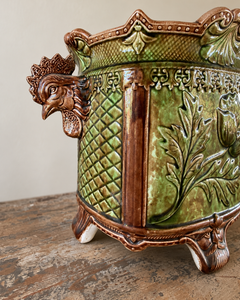 Pair of antique majolica cachepots with rooster-head handles, green and brown glaze and duck egg blue interiors.