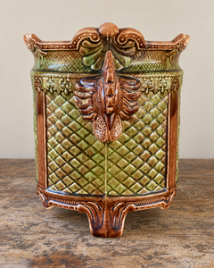 Pair of antique majolica cachepots with rooster-head handles, green and brown glaze and duck egg blue interiors.