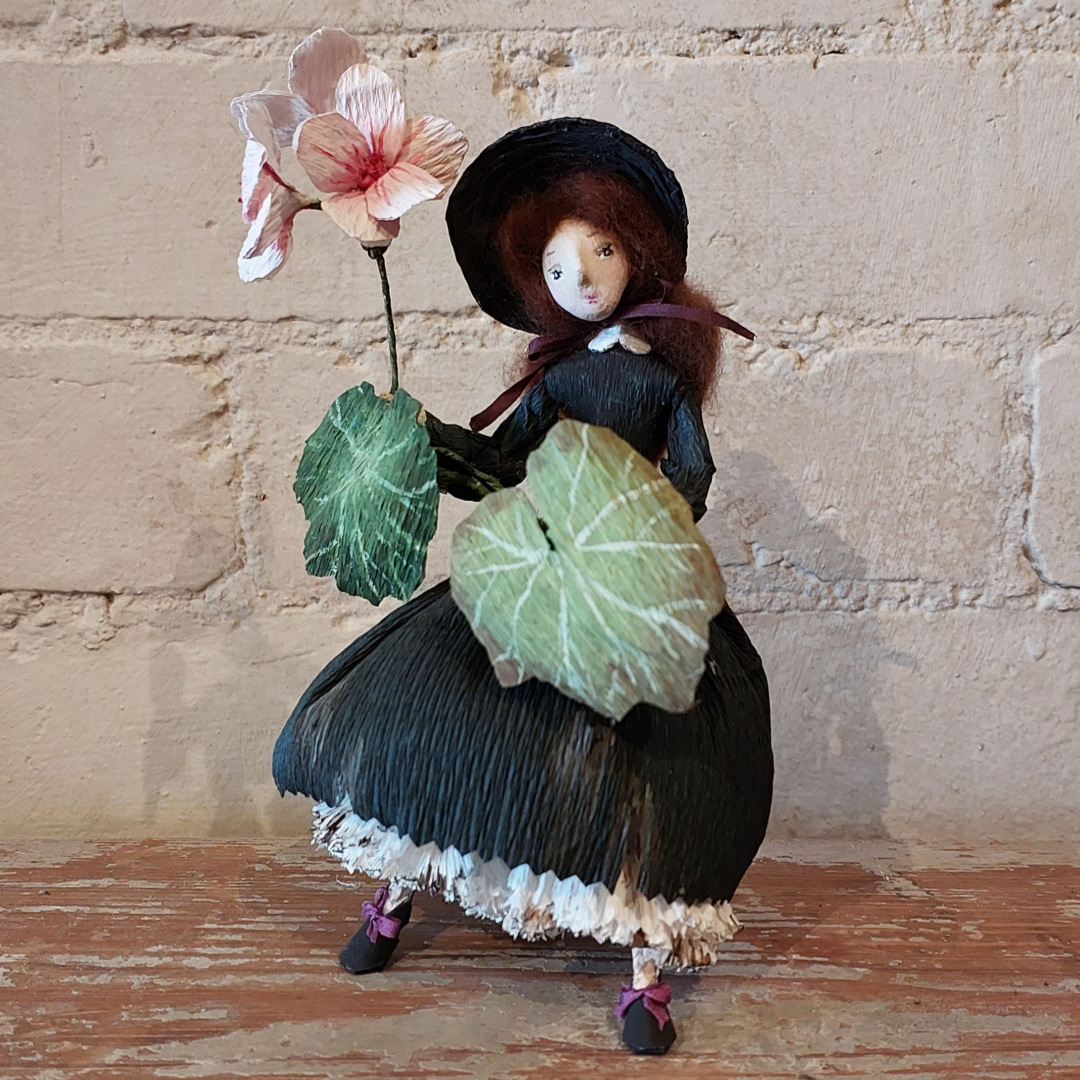 Josette Jane Burns wears Black dress with Geraniums