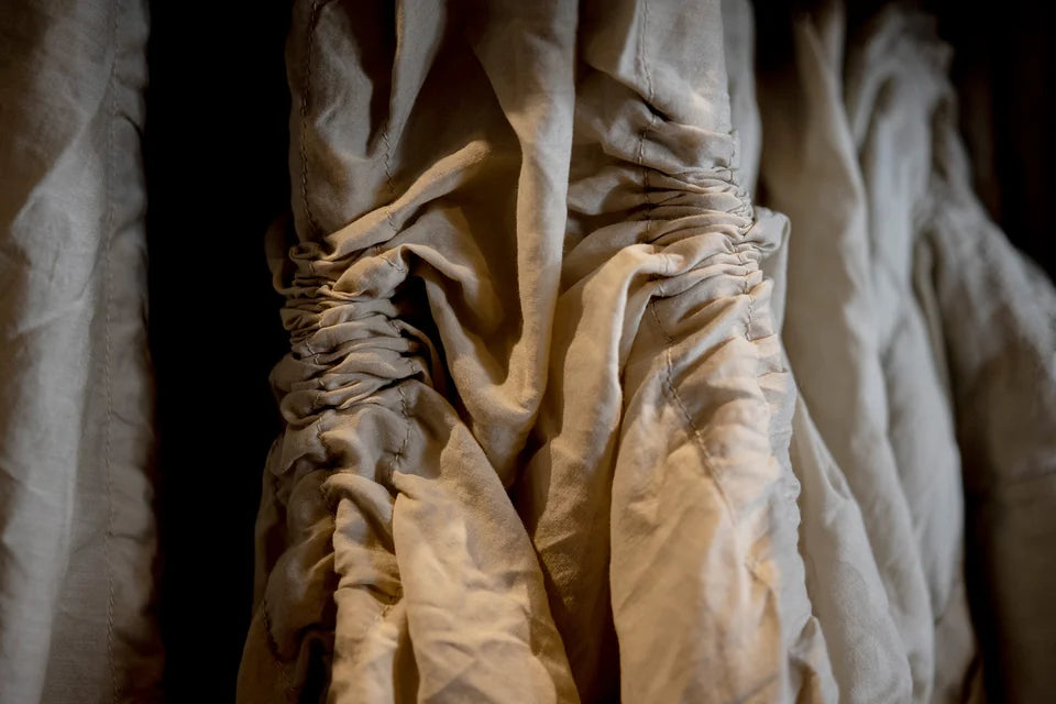 Close-up detail of gathered natural linen cloth