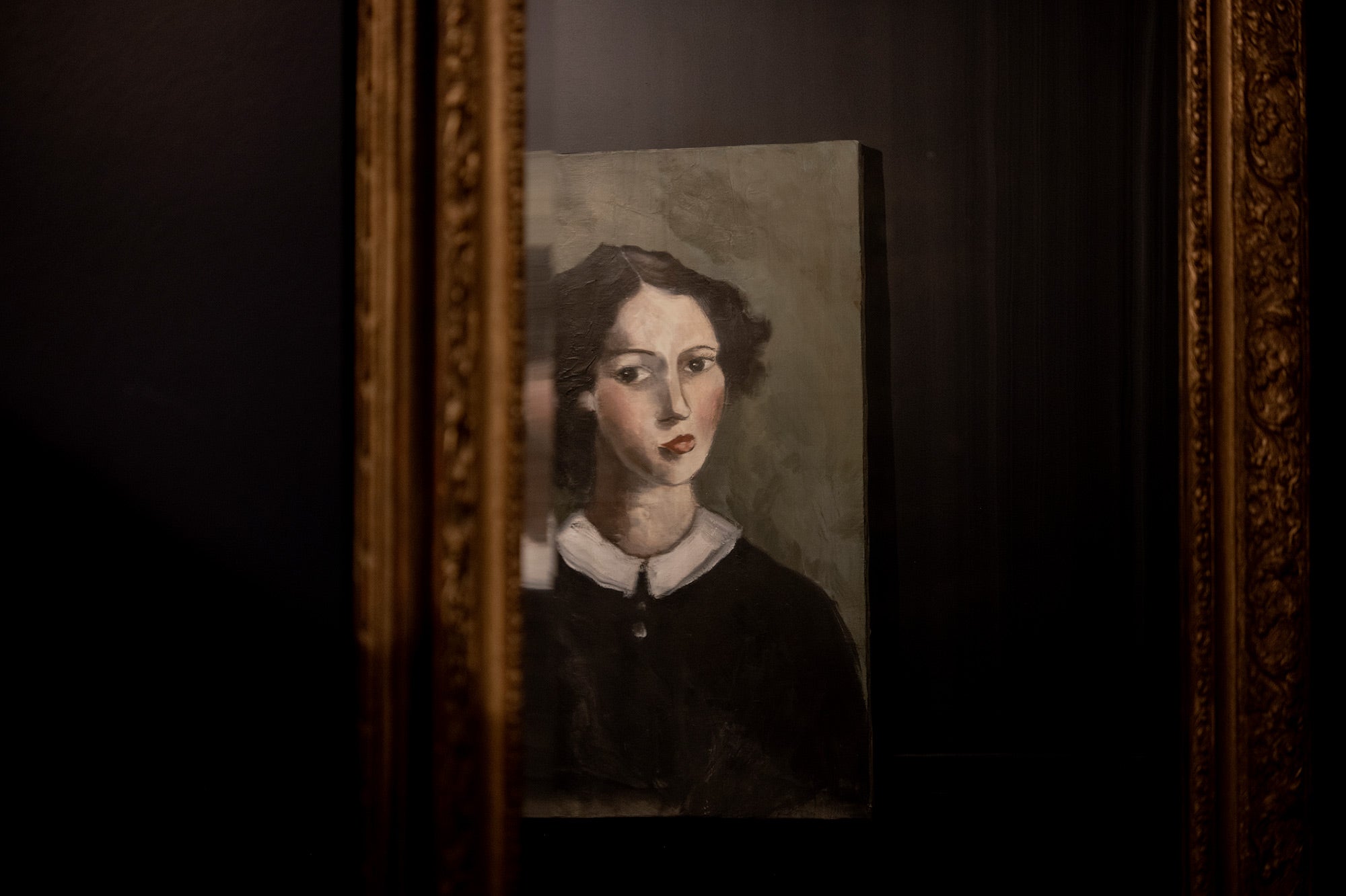 A portrait painting reflected in an antique mirror inside Manteau Noir